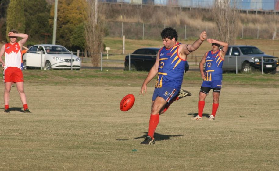 Dave Walker kicks downfield in a Redbacks Aussie Rules victory last season.